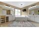Bright bathroom with a large soaking tub, double vanity, and tiled flooring at 12214 Ridgeside Rd, Indianapolis, IN 46256