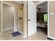 Bathroom with tiled floor and glass shower, leading to the bedroom at 12214 Ridgeside Rd, Indianapolis, IN 46256