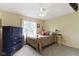 Bedroom with a full bed, blue dresser, and natural light at 12214 Ridgeside Rd, Indianapolis, IN 46256
