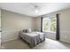 Bedroom with gray walls and carpet with a large window with forest view at 12214 Ridgeside Rd, Indianapolis, IN 46256