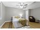 Cozy bedroom with a ceiling fan and a comfortable reading chair at 12214 Ridgeside Rd, Indianapolis, IN 46256