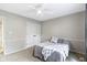 Bedroom with gray walls, a queen bed and carpet with a closet at 12214 Ridgeside Rd, Indianapolis, IN 46256