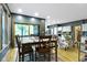 Charming dining area features a wood table, chairs, and sliding glass doors to the outside at 12214 Ridgeside Rd, Indianapolis, IN 46256