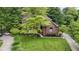 Charming brick home featuring a landscaped yard and inviting entrance at 12214 Ridgeside Rd, Indianapolis, IN 46256