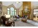 Bright living room with fireplace, vaulted ceilings, and lots of natural light at 12214 Ridgeside Rd, Indianapolis, IN 46256