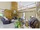 Open-concept living room with fireplace, high ceilings, and lots of natural light at 12214 Ridgeside Rd, Indianapolis, IN 46256