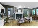 Cozy living room with fireplace, hardwood floors, and views of the backyard at 12214 Ridgeside Rd, Indianapolis, IN 46256