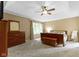Spacious main bedroom featuring tray ceiling, large window, and neutral decor at 12214 Ridgeside Rd, Indianapolis, IN 46256