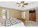 Comfortable main bedroom featuring a ceiling fan, carpet flooring, and neutral paint at 12214 Ridgeside Rd, Indianapolis, IN 46256