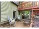 Relaxing backyard patio with rocking chairs and fire pit, perfect for outdoor enjoyment at 12214 Ridgeside Rd, Indianapolis, IN 46256