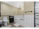 Bright bathroom featuring a tiled shower, soaking tub, toilet, and modern gray flooring at 12222 Cable Dr, Indianapolis, IN 46236