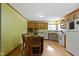Open kitchen with a center island, wood cabinetry, and plenty of counter space for cooking at 12222 Cable Dr, Indianapolis, IN 46236
