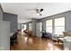Open-concept living area with neutral tones, hardwood floors, and natural light from large windows at 12222 Cable Dr, Indianapolis, IN 46236