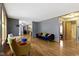 Open-concept living room with hardwood floors, comfortable seating, and plenty of natural light at 12222 Cable Dr, Indianapolis, IN 46236