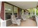 Relaxing covered front porch with comfortable seating and views of the surrounding landscape at 12222 Cable Dr, Indianapolis, IN 46236
