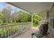 Charming covered porch with a scenic view of the lush front yard and surrounding greenery at 12222 Cable Dr, Indianapolis, IN 46236
