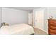 This bedroom features neutral walls, carpet, and convenient closet access at 1302 Main St, Elwood, IN 46036