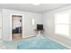 Bedroom featuring neutral walls, plush carpeting, and closet/storage, creating a tranquil and inviting space at 1302 Main St, Elwood, IN 46036