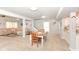 Open layout: Dining area seamlessly connects to the living room and kitchen at 1302 Main St, Elwood, IN 46036