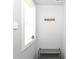 Entryway with a shelf and hooks for storage; a Ring security system is present at 1302 Main St, Elwood, IN 46036