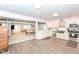 Open kitchen with stainless steel appliances and breakfast bar overlooking the dining area at 1302 Main St, Elwood, IN 46036
