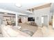 Inviting living room with access to other rooms with neutral color scheme and lots of natural light at 1302 Main St, Elwood, IN 46036
