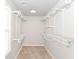 Walk-in closet with ample shelving and storage space, perfect for organizing clothing and accessories at 1302 Main St, Elwood, IN 46036