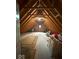 Large attic featuring exposed wooden beams and plenty of storage space at 13221 Griffin Run, Carmel, IN 46033