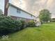 Spacious backyard with a view of the house, landscaping, and deck at 13221 Griffin Run, Carmel, IN 46033