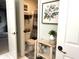 Well-decorated bathroom with a toilet, floral print, and shelves for storage at 13221 Griffin Run, Carmel, IN 46033