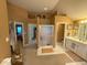 Bathroom with large shower, large vanity and sink with open access to bedroom and closet at 13221 Griffin Run, Carmel, IN 46033