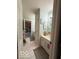 Bright, clean bathroom featuring a single sink vanity and neutral tile at 13221 Griffin Run, Carmel, IN 46033