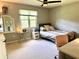 Cozy bedroom with a desk area, full bed, and window for lots of natural light at 13221 Griffin Run, Carmel, IN 46033