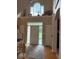 Bright foyer with hardwood floors, white trim, and a large window above the front door at 13221 Griffin Run, Carmel, IN 46033