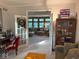 Bright living room offers open doorway to Gathering room, comfortable seating, and charming decor at 13221 Griffin Run, Carmel, IN 46033