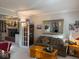 Cozy living room features comfortable seating, a view into the Gathering room, and a sunlit ambiance at 13221 Griffin Run, Carmel, IN 46033