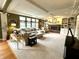 Inviting living room with a fireplace, built-in bookshelves, and large windows that flood the space with natural light at 13221 Griffin Run, Carmel, IN 46033