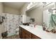 Bathroom with a large mirror, white countertop, and vanity with dark wood cabinets at 1331 Mccormicks Cir, Danville, IN 46122