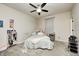 Cozy bedroom with carpet flooring, ceiling fan, and a comfortable bed with decorative pillows at 1331 Mccormicks Cir, Danville, IN 46122