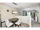 Charming dining area featuring a stylish light fixture and seamless living room access at 1331 Mccormicks Cir, Danville, IN 46122