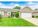 Charming home featuring a two-car garage, brick accents, and a well-maintained lawn at 1331 Mccormicks Cir, Danville, IN 46122