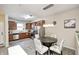Eat-in kitchen with stainless steel appliances, warm wood cabinets, and modern lighting at 1331 Mccormicks Cir, Danville, IN 46122