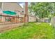 Expansive backyard with a deck, grassy area, and privacy fence offering ample outdoor space at 1357 Brownswood Dr, Brownsburg, IN 46112