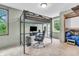 Bedroom with a bunk bed featuring a desk, gaming chair, and closet at 1357 Brownswood Dr, Brownsburg, IN 46112