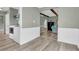 Hallway with easy access to the laundry room and a living area with sofa at 1357 Brownswood Dr, Brownsburg, IN 46112