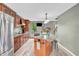 Updated kitchen boasting stainless steel appliances, granite countertops, and a stylish center island at 1357 Brownswood Dr, Brownsburg, IN 46112