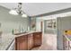 Lovely kitchen with granite countertops, stainless steel refrigerator, and decorative lighting at 1357 Brownswood Dr, Brownsburg, IN 46112
