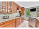 Kitchen featuring granite countertops, stainless steel appliances, and ample wood cabinetry at 1357 Brownswood Dr, Brownsburg, IN 46112