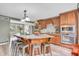 Spacious kitchen featuring a large granite island, stainless appliances and updated finishes at 1357 Brownswood Dr, Brownsburg, IN 46112