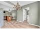 Open floor plan featuring kitchen island and dining area with ornamental lighting at 1357 Brownswood Dr, Brownsburg, IN 46112